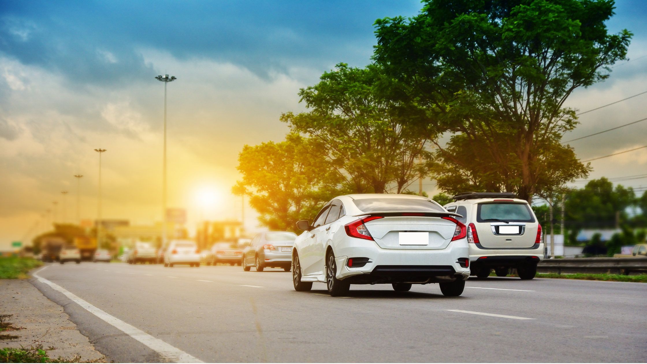 cars driving at sunset